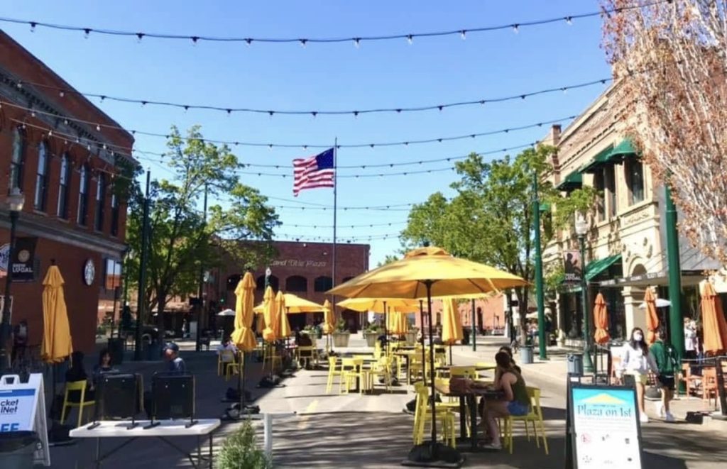 Evening outdoor dining with string lights in downtown Walla Walla, near where Murder Mystery at The Marc takes place.